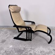 Rocking lounge chair, curved wood, leather, Viennese cane design.