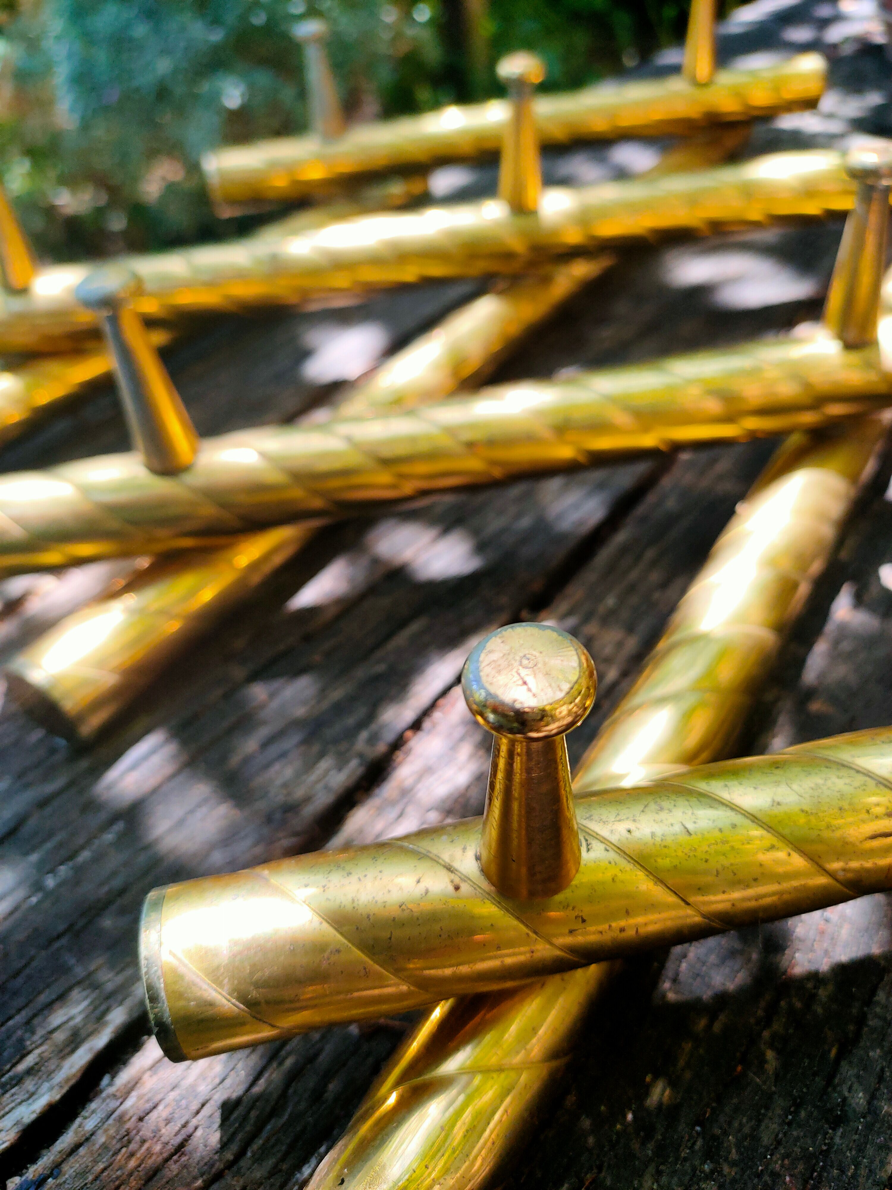 Wall coat rack in gilded metal