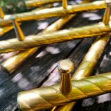 Wall coat rack in gilded metal