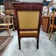 Armchair with scroll arms and sabre legs in mustard velvet, 19th century.