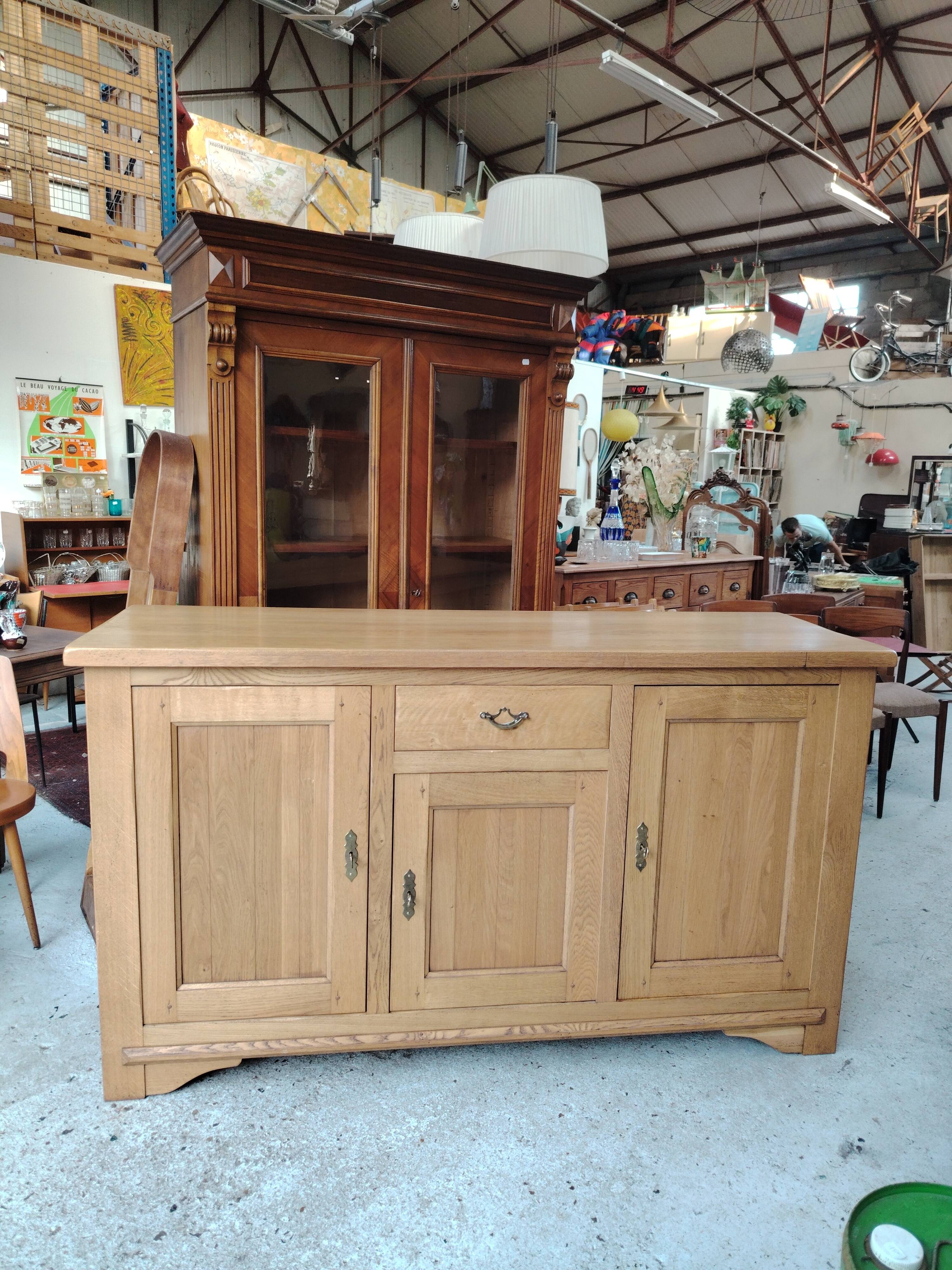 Low sideboard in light solid oak with 3 doors and 1 drawer.