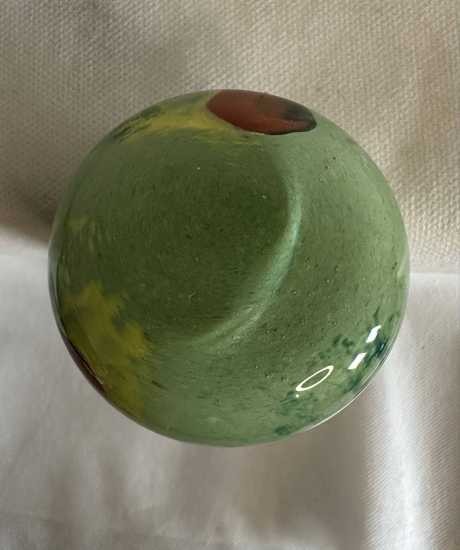 Single flower vase in blown green glass