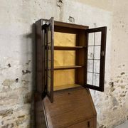 Oak display secretary cabinet with drop-down front, two sections.