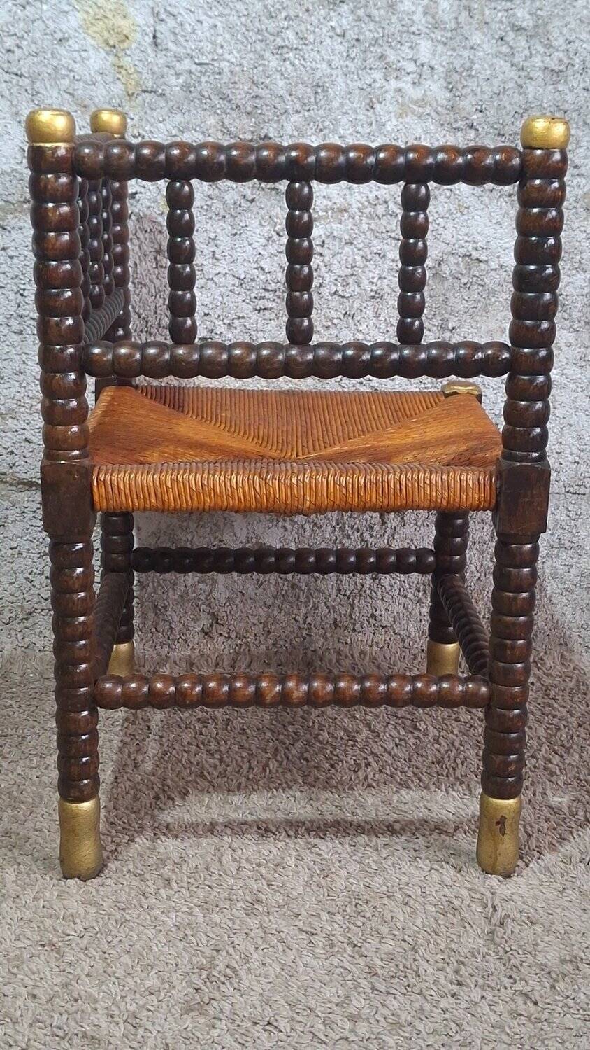 Fireplace corner chair in Louis XIII style, turned wood with braided rush, 19th century.