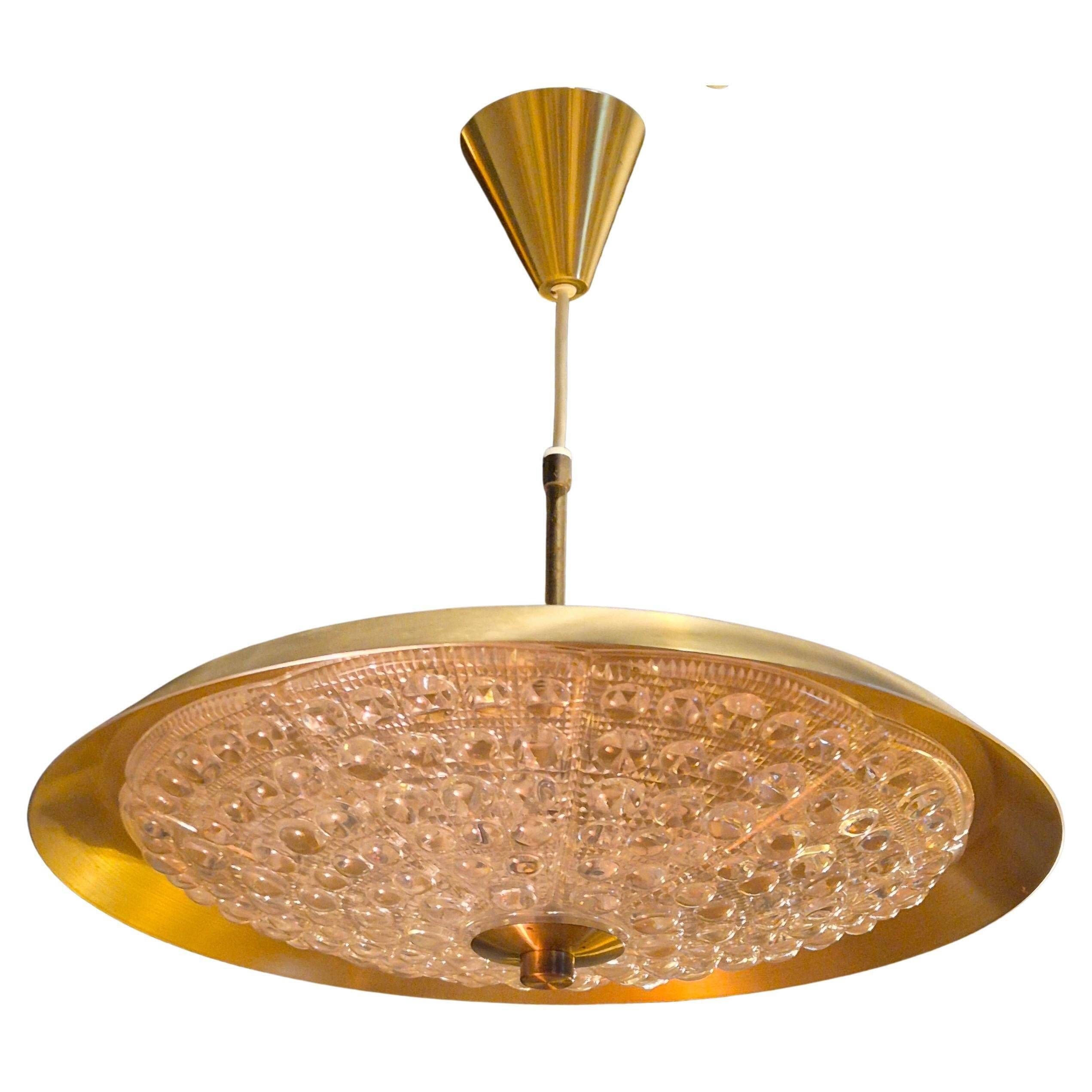 Carl Fagerlund, modern Swedish pendant in brass and beautiful Orrefors glass.
