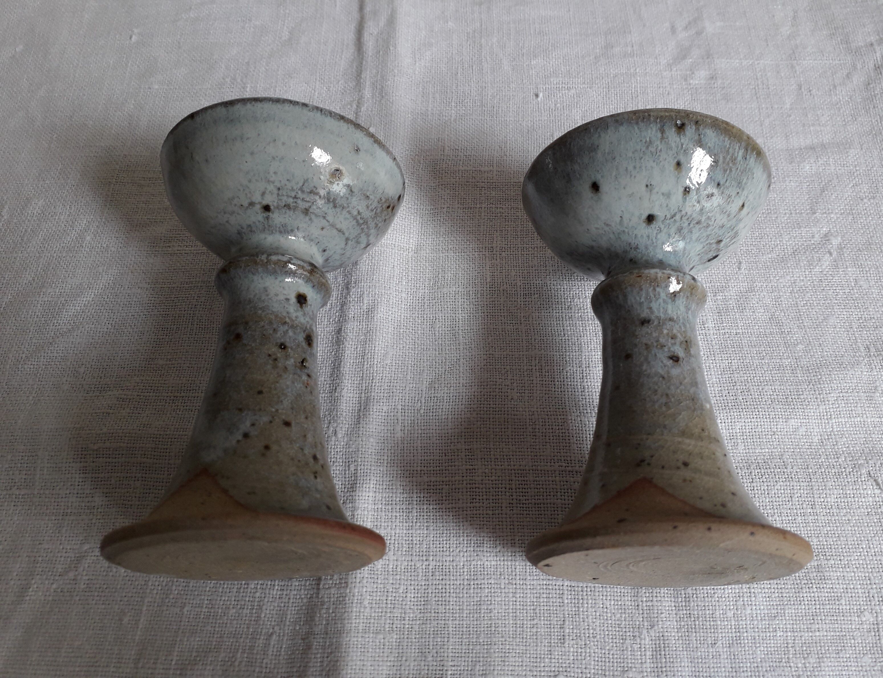 Pair of sandstone candlesticks