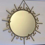 Miroir soleil en métal doré