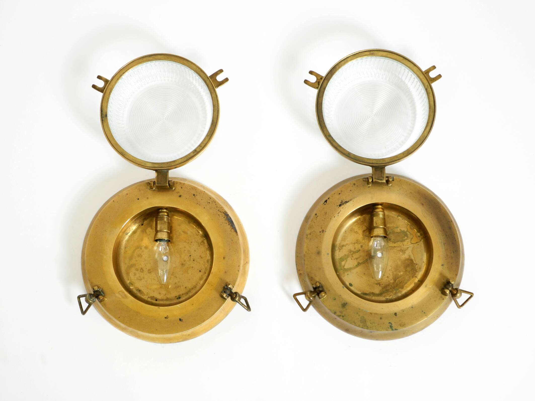 A pair of large, heavy 50s maritime ship wall lamps made of brass and glass