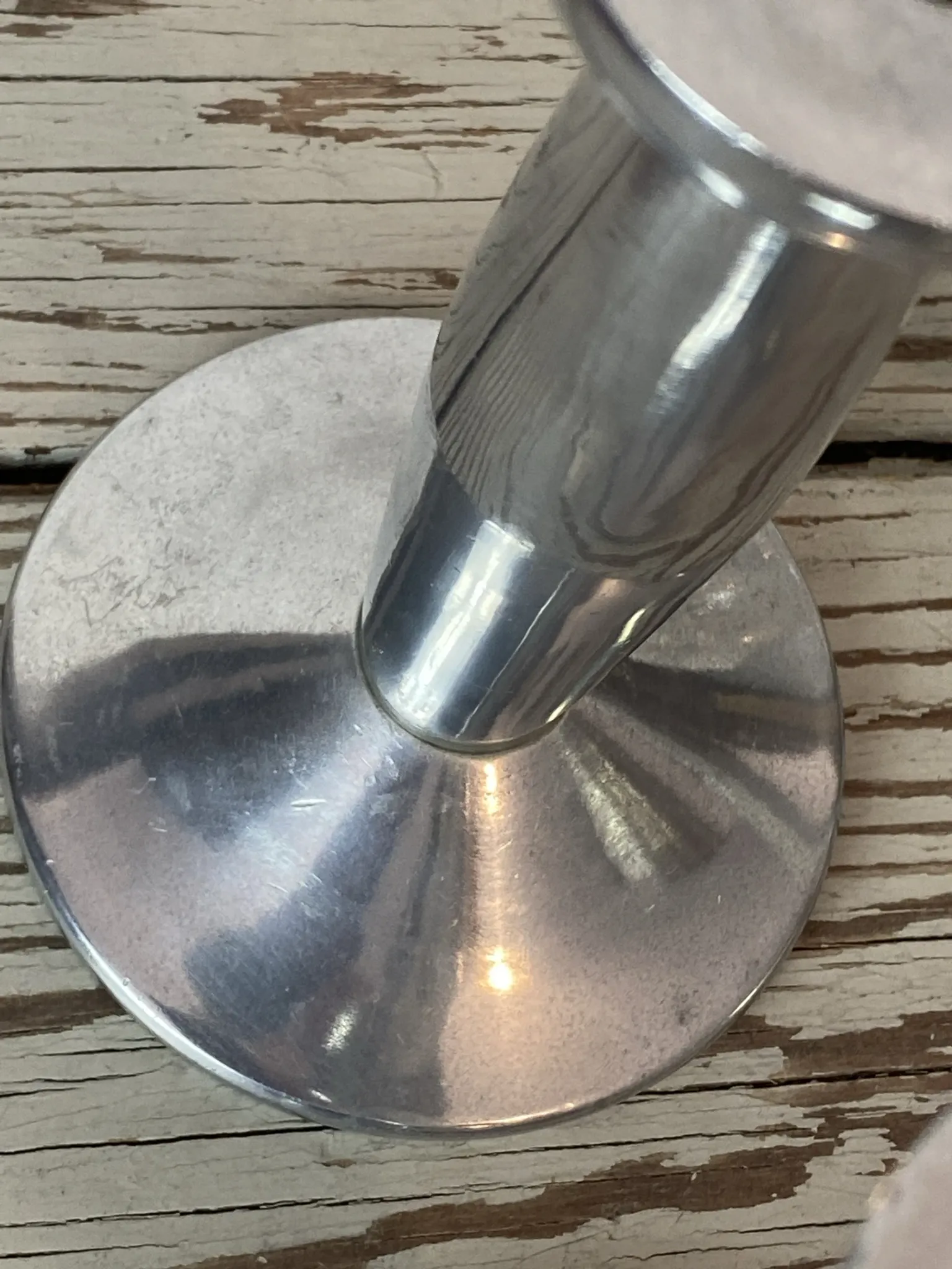 Pair of minimalist polished aluminium candle holders