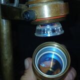 Bronze boat lamp on wooden base