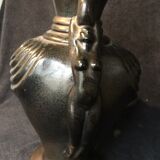 Black ceramic vase caught in naked women's bodies