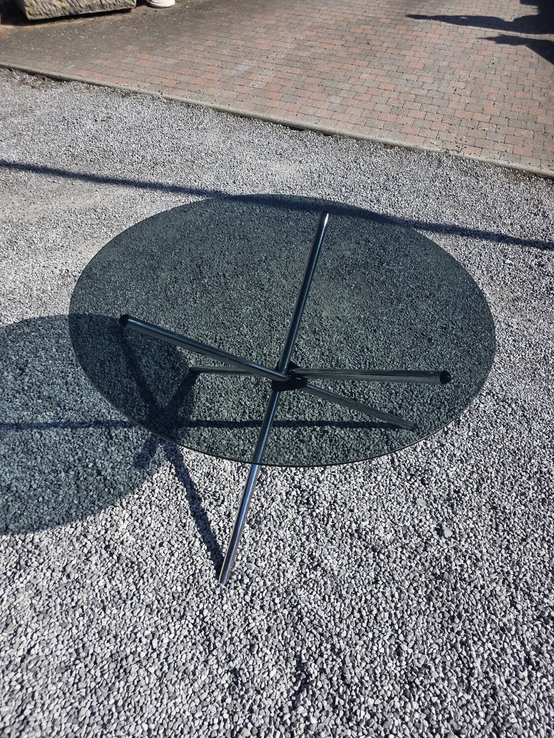 Round chrome metal table with smoked glass top from the 70s