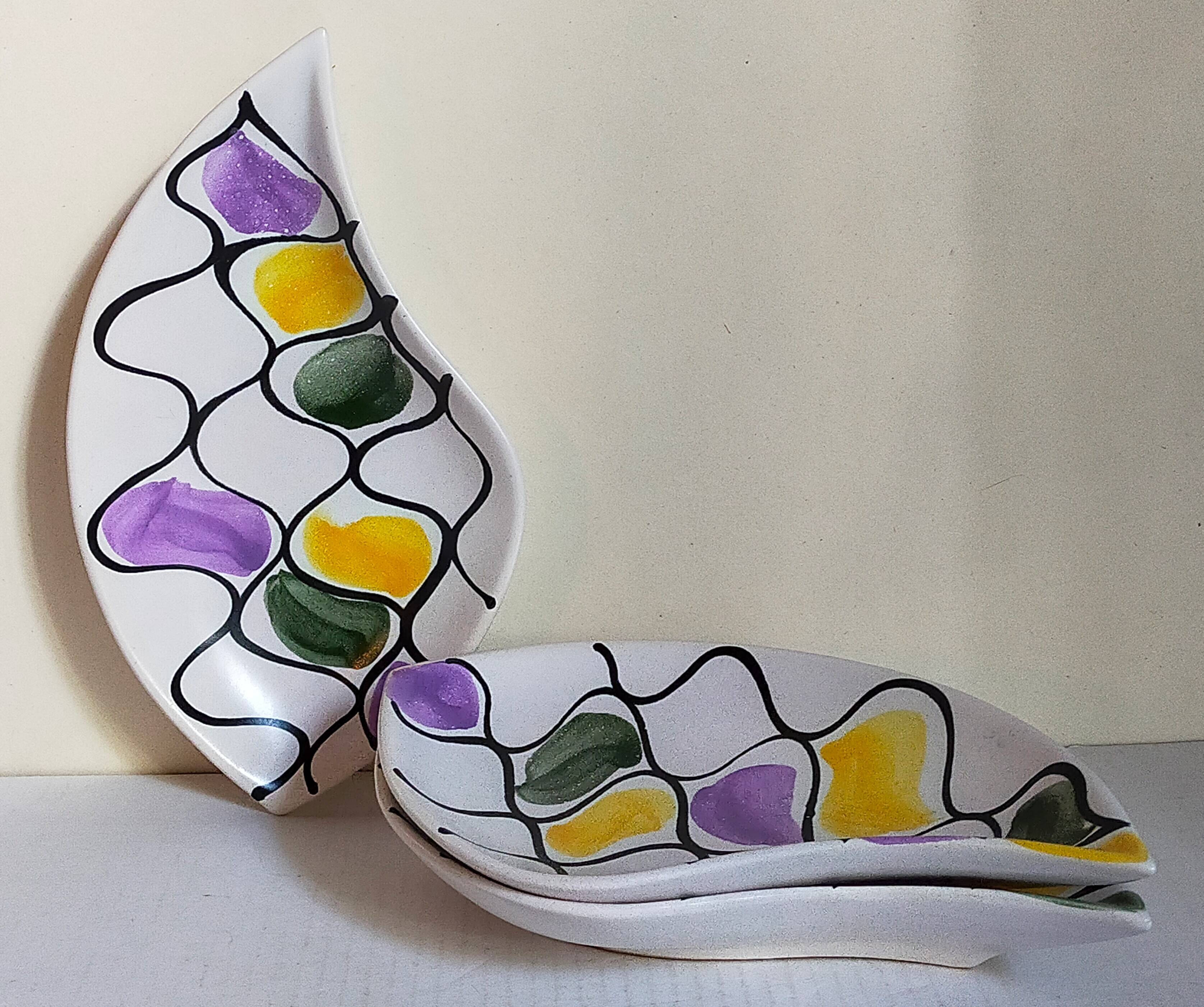 Three vintage free-form ceramic ravine dishes from the 1950s