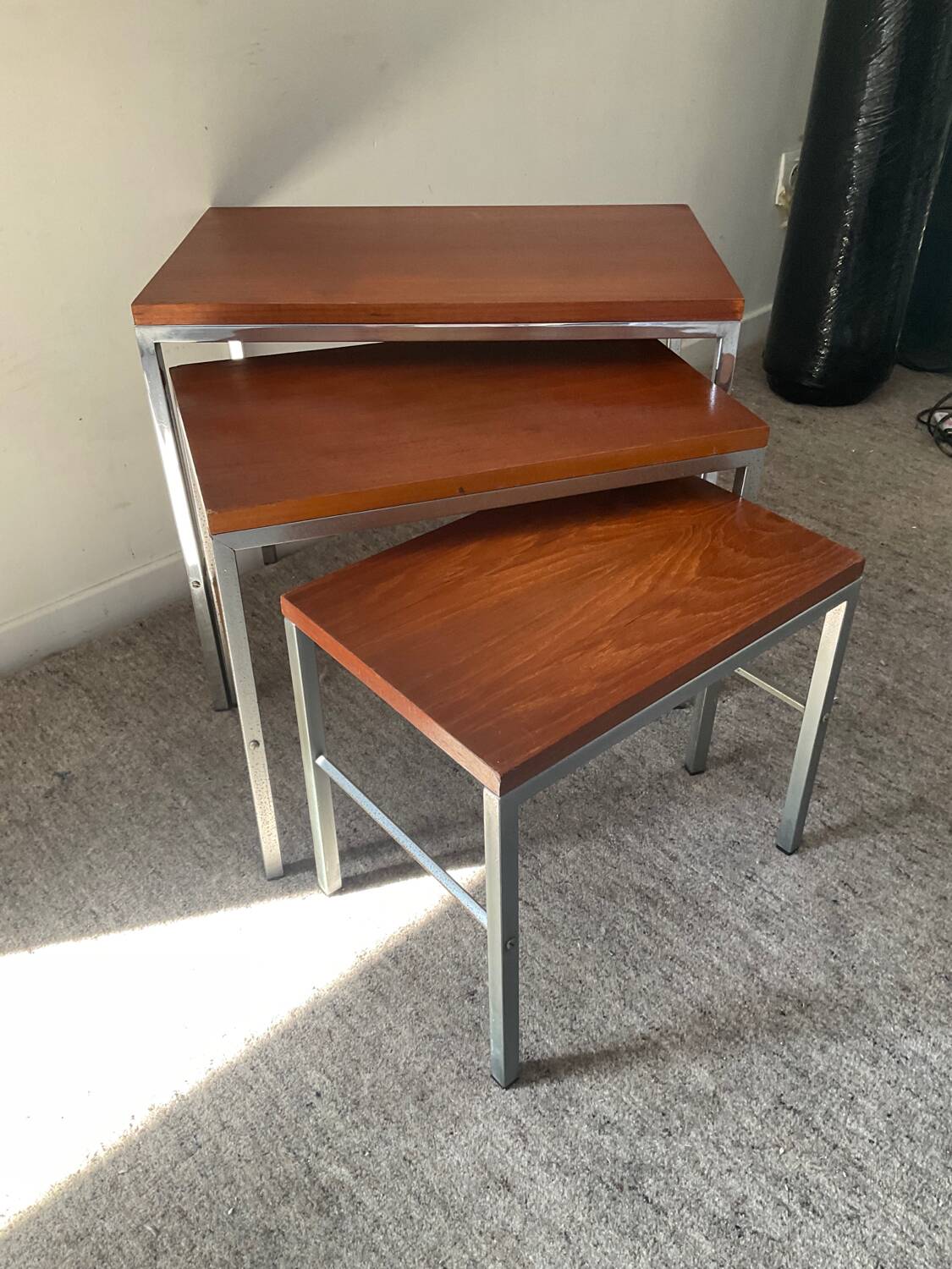 Trio of teak and chrome metal nesting tables from the 60s-70s