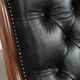 Fauteuil chesterfield en cuir de vachette noir classique et confortable