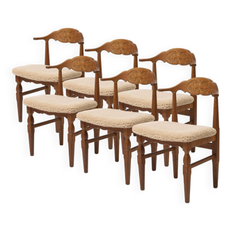 Set of 6 dining chairs by Hennig Kjaernulf reupholstered in sheepskin