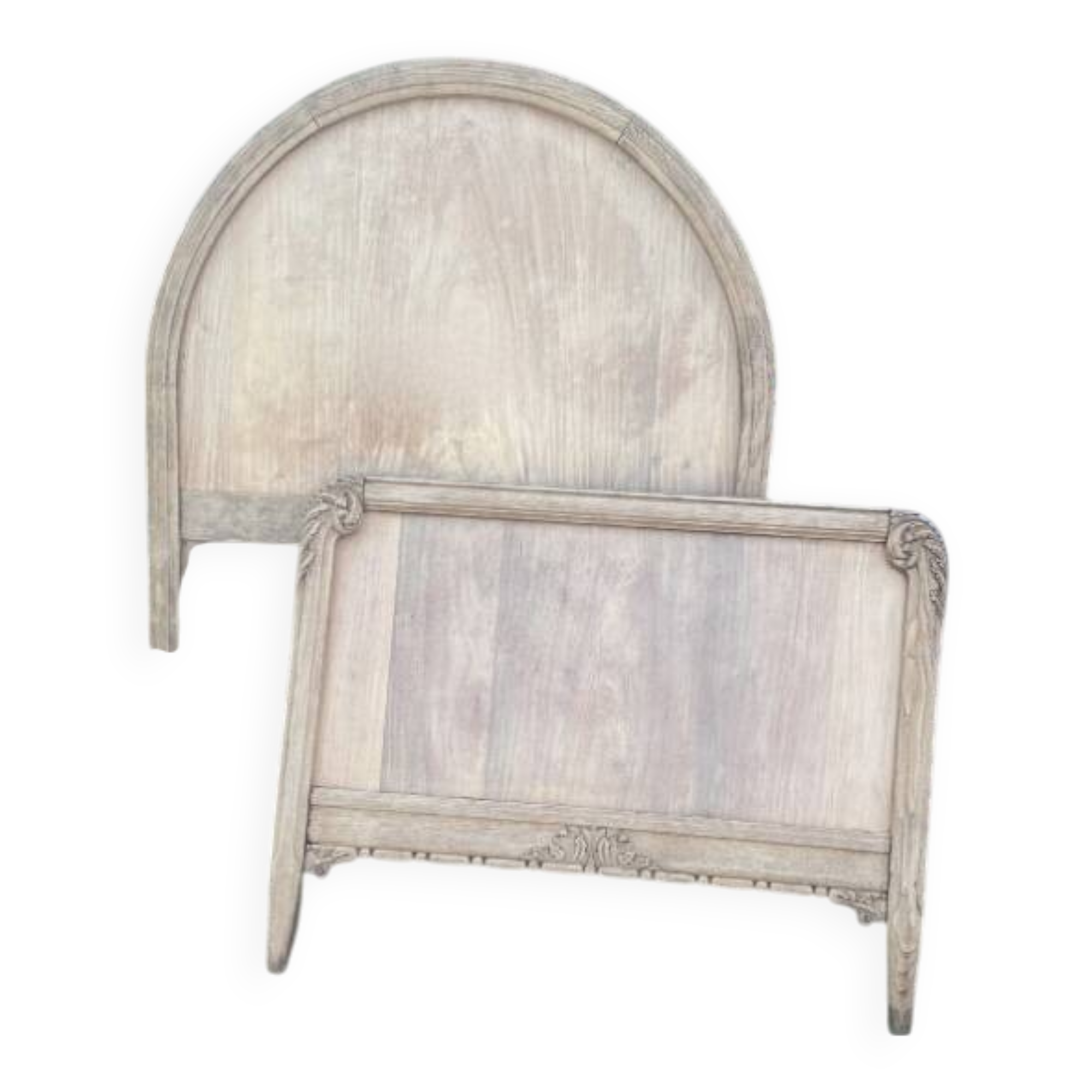 Antique solid wood bed with a carved rounded headboard — Louis XV style