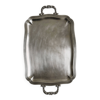 Silver metal serving tray with sculpted handles
