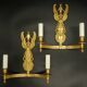 Large pair of wall sconces with winged caryatids in Empire style - gilded bronze