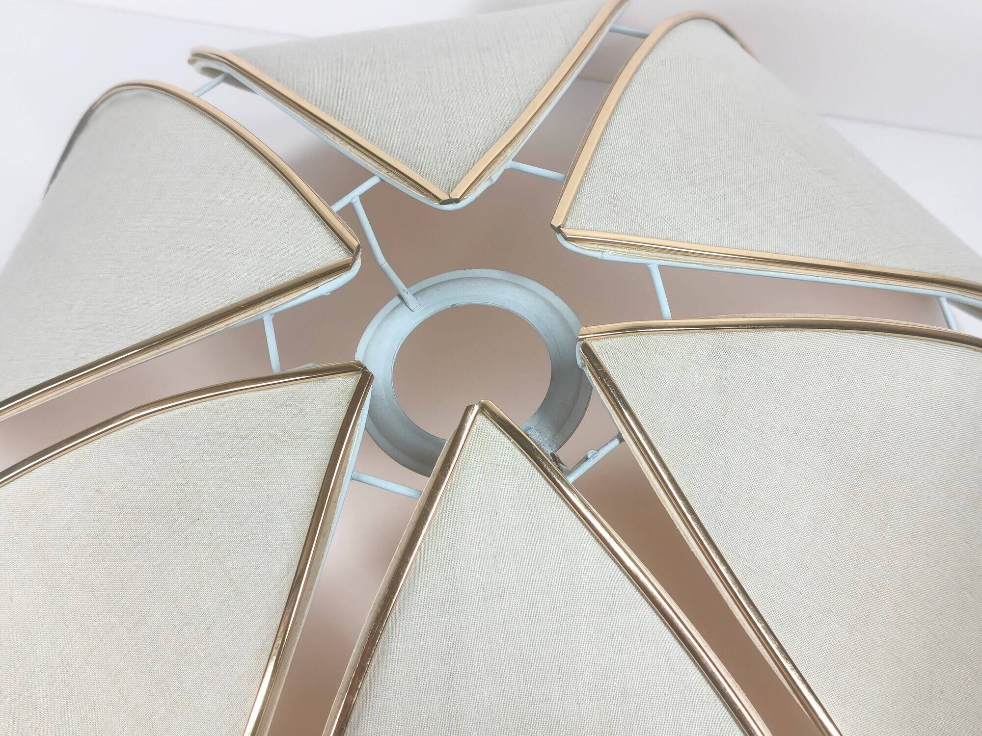 1970s ceiling light with floral design, light beige shade with gold finish.