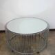 A round coffee table with a mirrored top, from the 1990s.