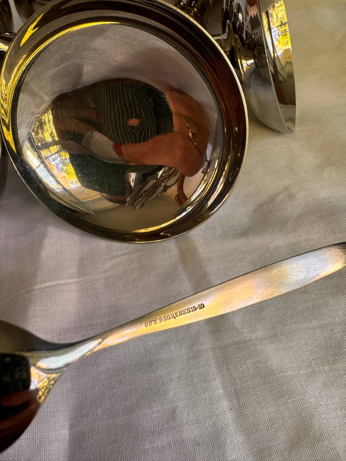 Set of 6 stainless steel ice cream bowls by Guy Degrenne with matching spoons.