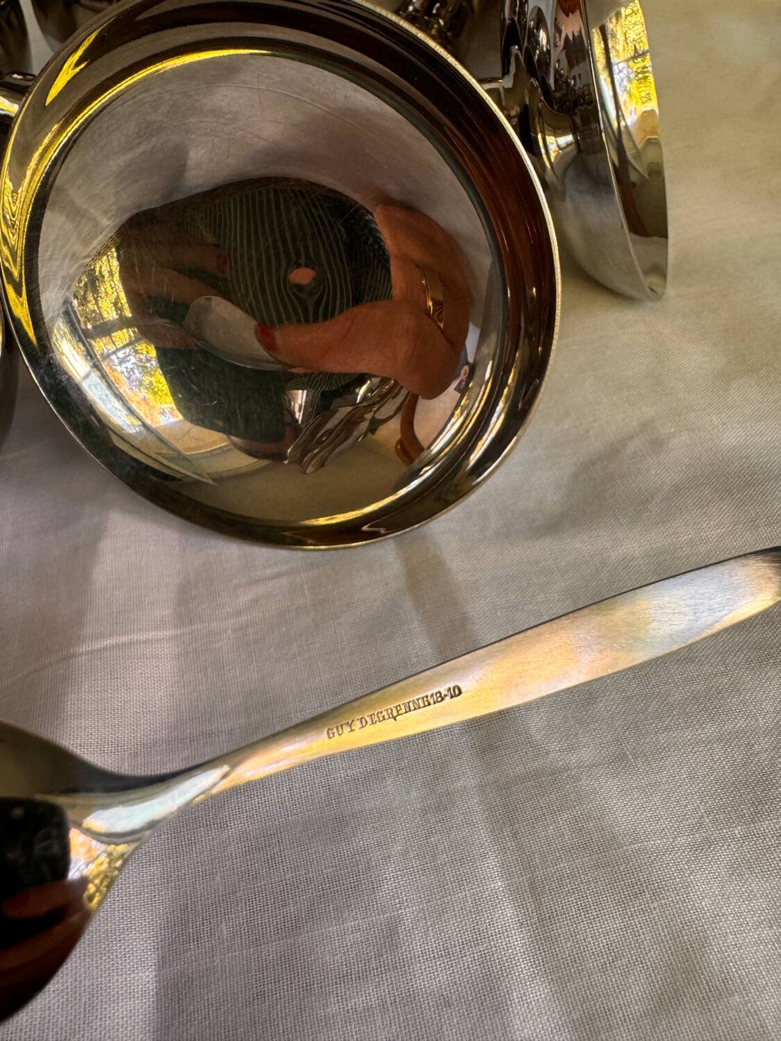 Set of 6 stainless steel ice cream bowls by Guy Degrenne with matching spoons.