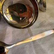 Set of 6 stainless steel ice cream bowls by Guy Degrenne with matching spoons.
