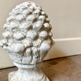 Ornamental pine cone in bleached concrete