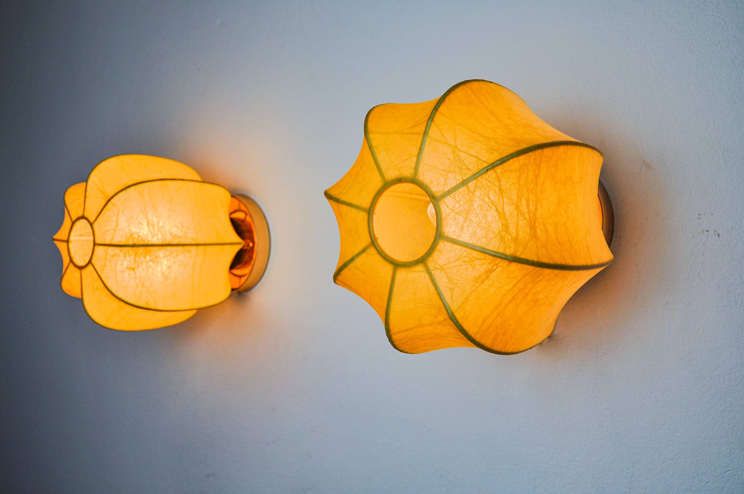 Pair of circular "cocoon" wall lights, resin and pine, Italy, 1970