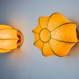 Pair of circular "cocoon" wall lights, resin and pine, Italy, 1970