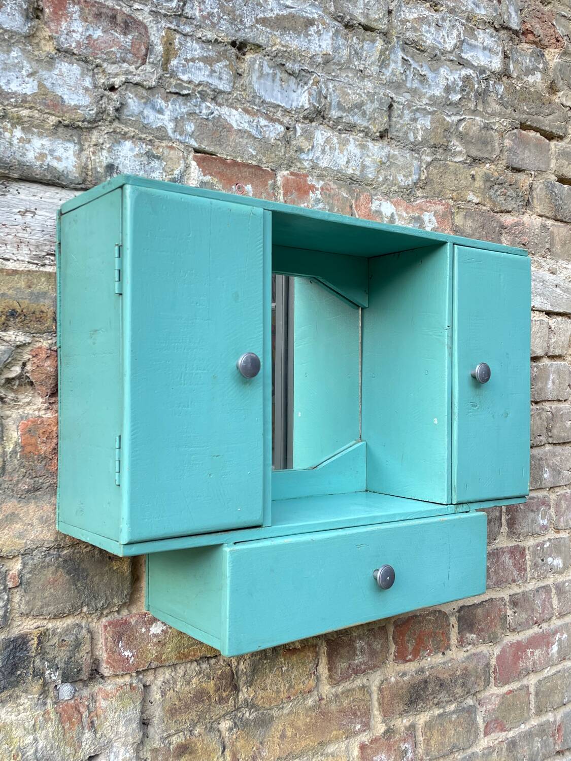 Old wall-mounted bathroom cabinet