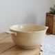 Vintage salad bowl in ivory faience from Chantilly with a rainbow trim.