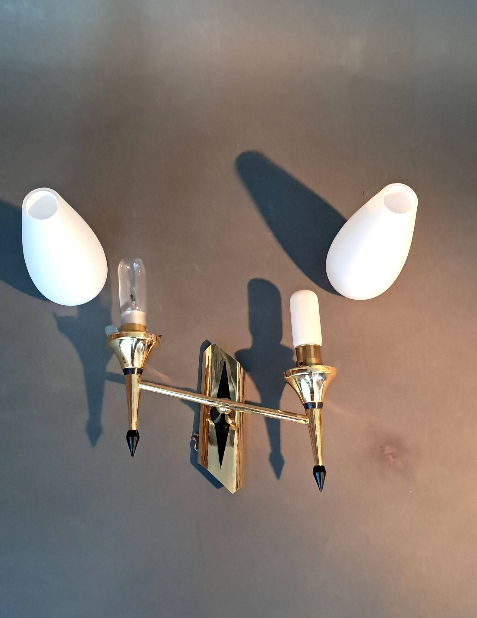 Small two-light wall lamp, white opaline and gilded brass, Circa 1960.