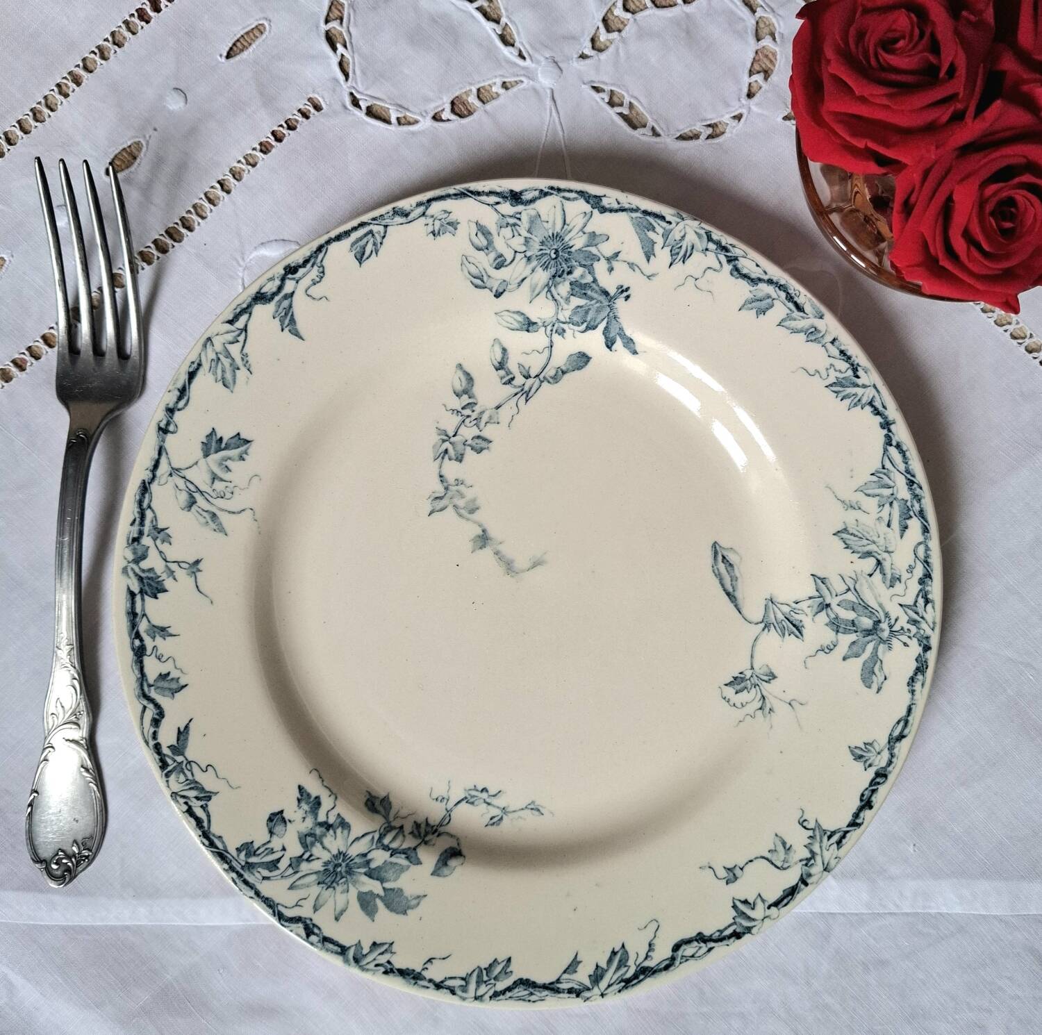 Old mismatched flat plates in iron earth earthenware accompanied by a dish