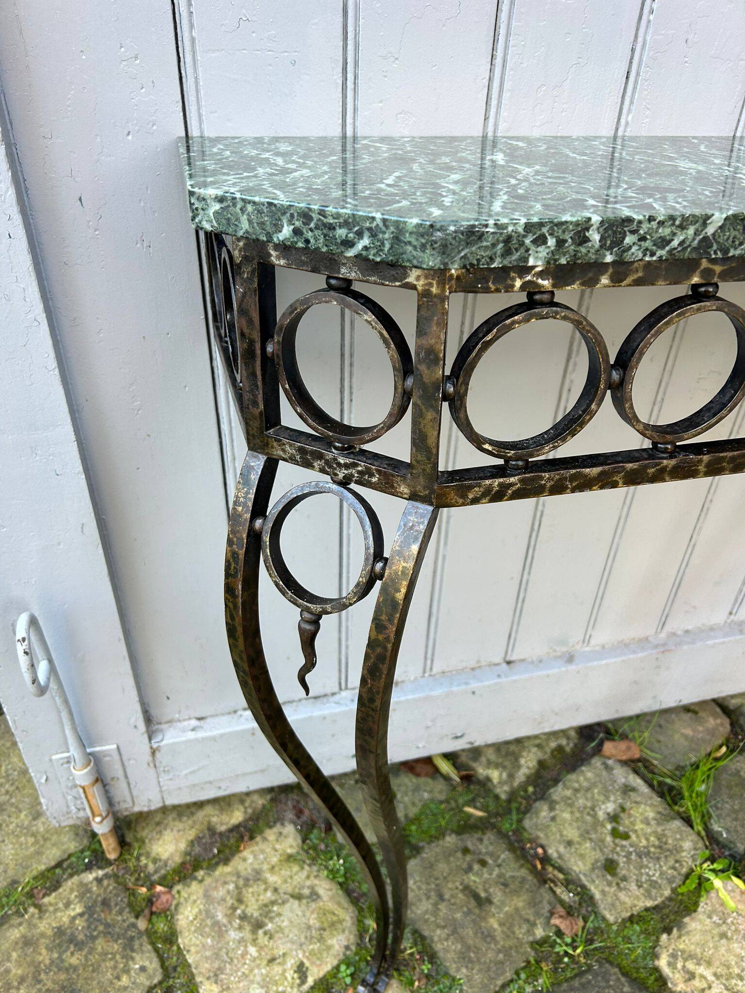 Console in wrought and hammered iron and green marble