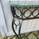 Console in wrought and hammered iron and green marble