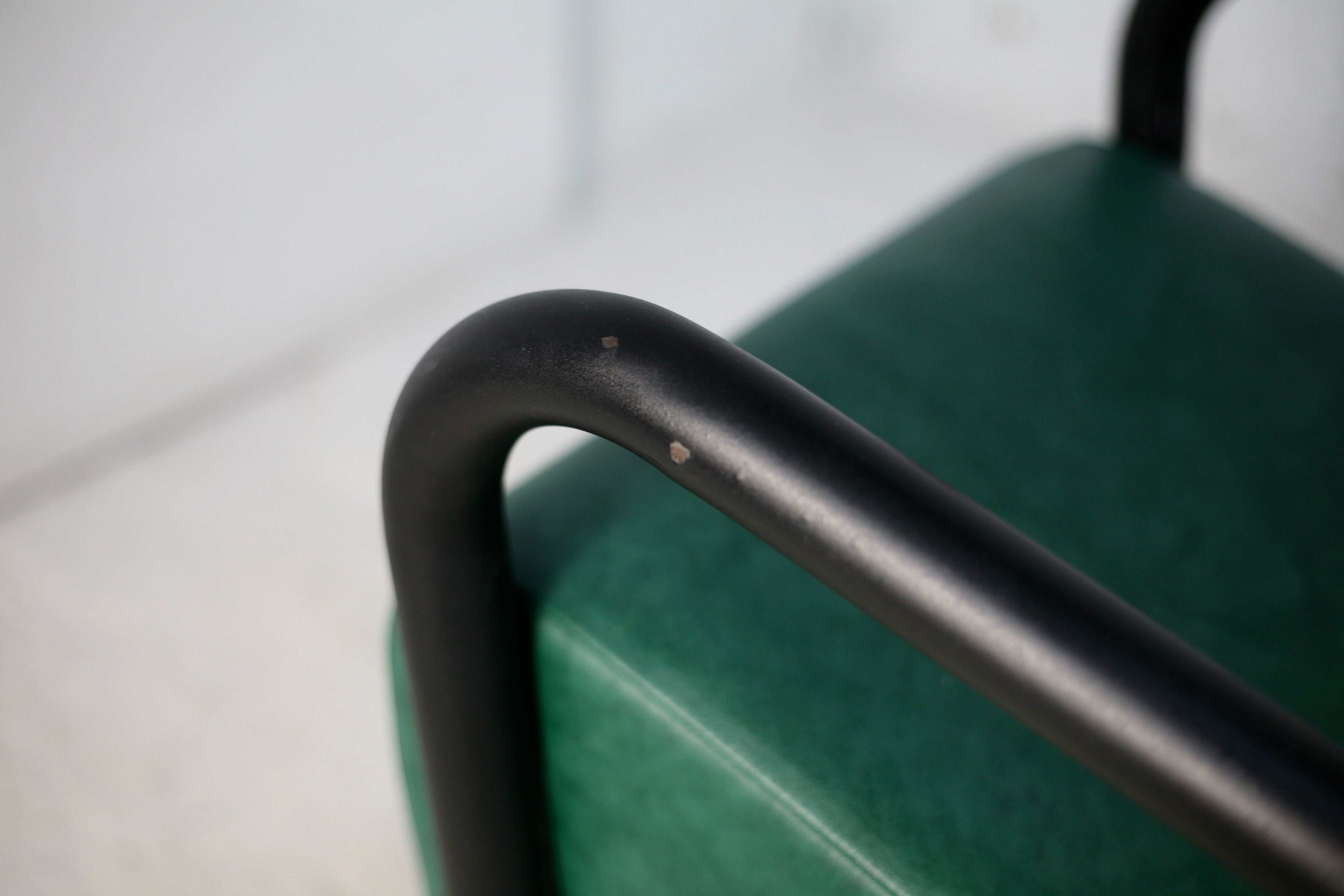 Pair of armrest heaters. Steel and green imitation leather. France, circa 1980