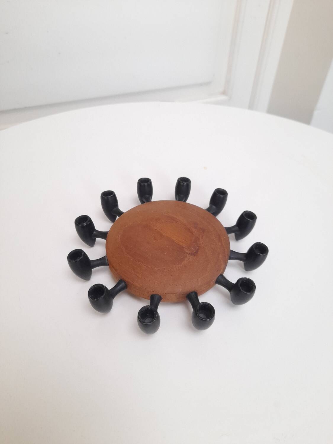 Teak and metal candlestick for 12 candles.
