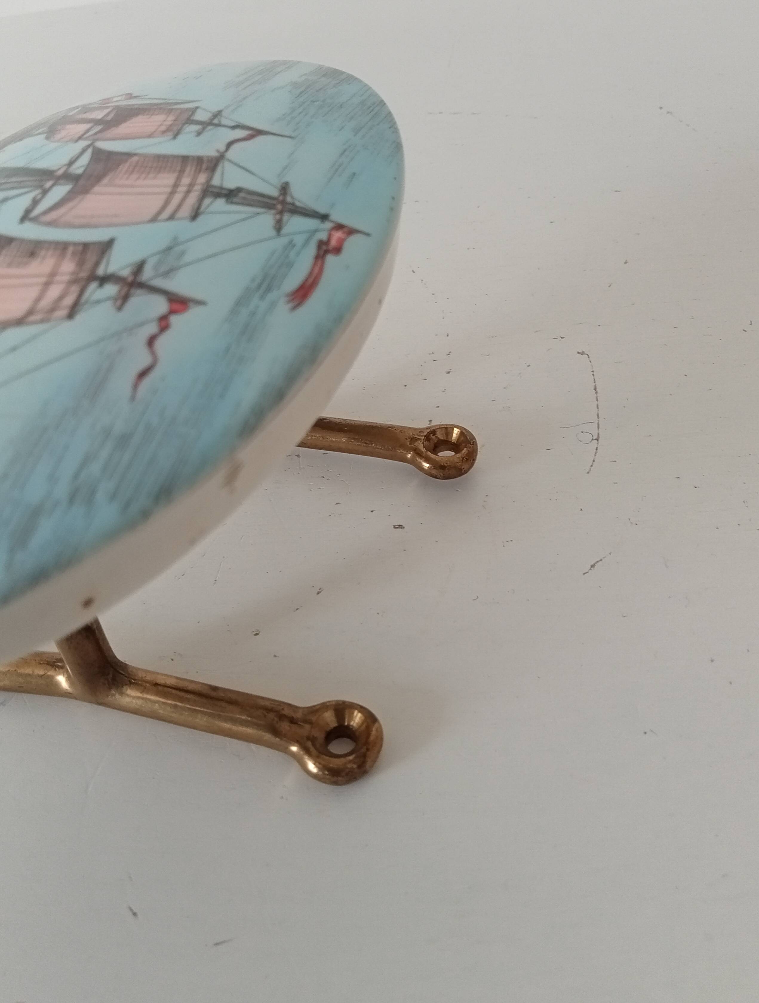 Vintage wall coat hook in brass and Bakelite.