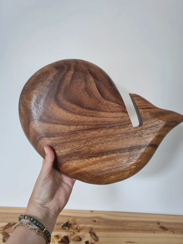 Empty wooden and mother-of-pearl whale pocket display