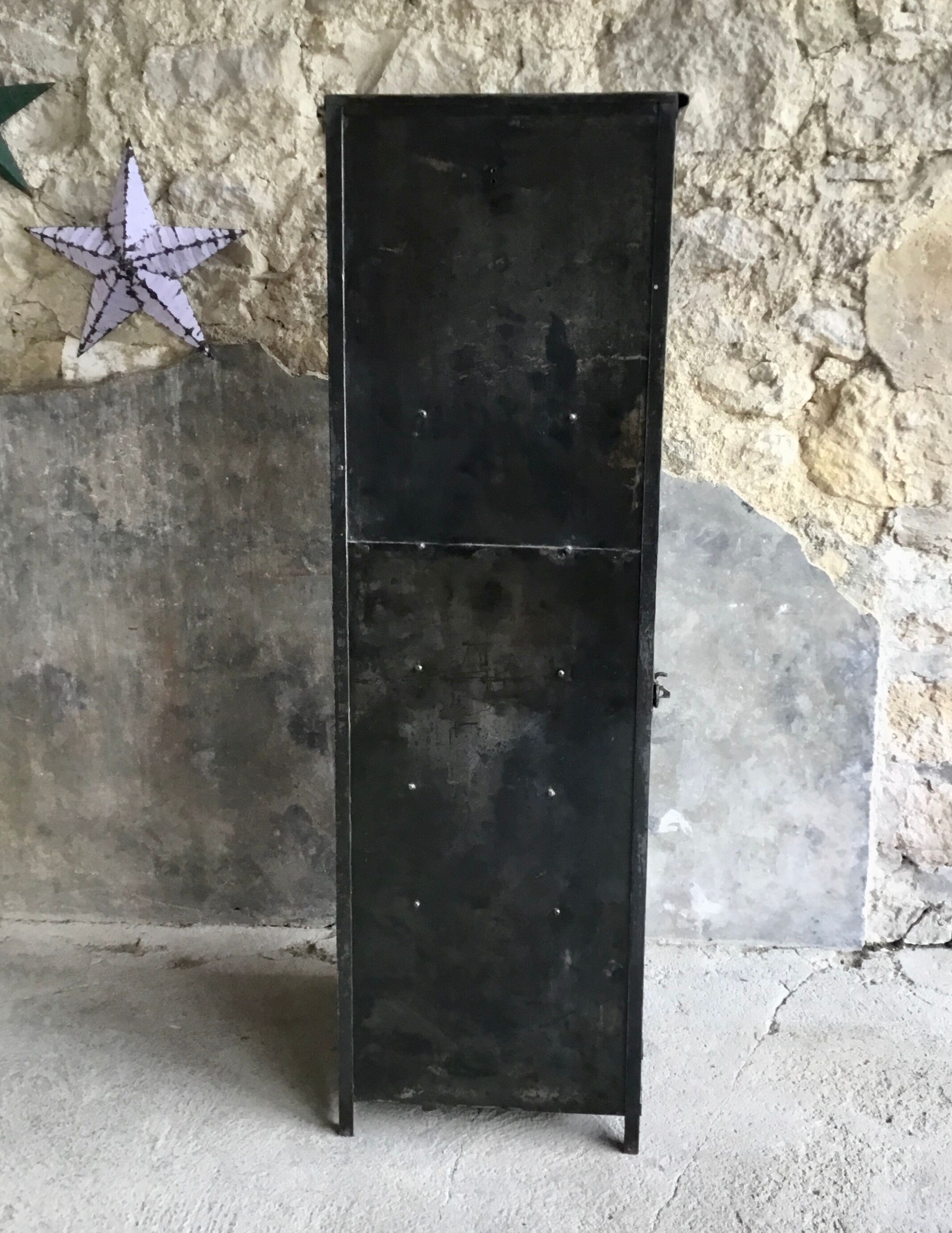 Riveted cloakroom converted into storage cabinet - early twentieth century