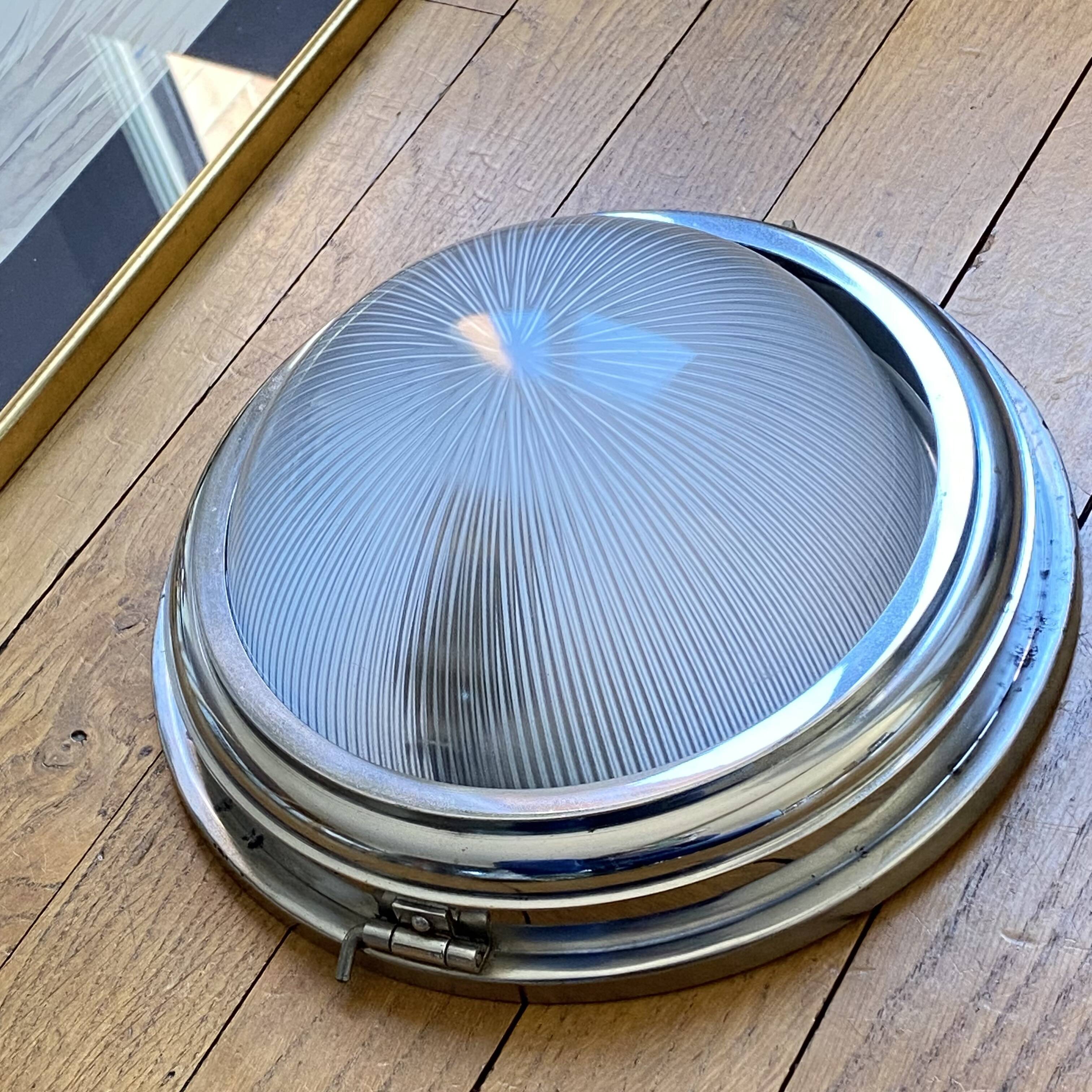 Thick glass ceiling light fixture with a chrome metal support, Holophane type.