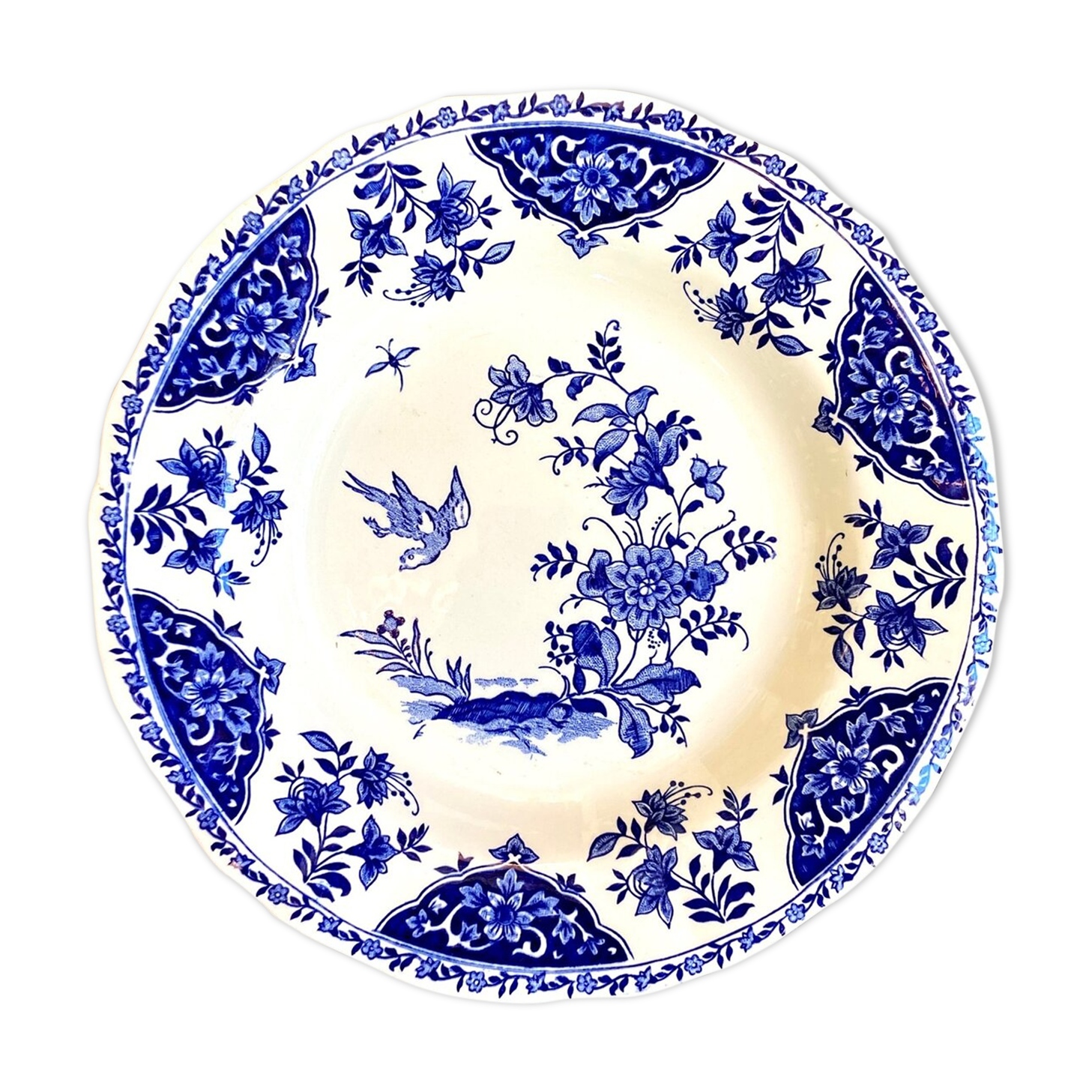 Round and hollow gien dish in white and blue enamelled earthenware