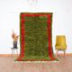 Handmade pure wool rug in green and red, size 140/260 cm.