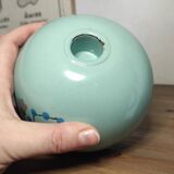 Floral candle holder in enamelled metal