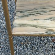 Pair of neoclassical side tables in bronze, brass, marble, and o.