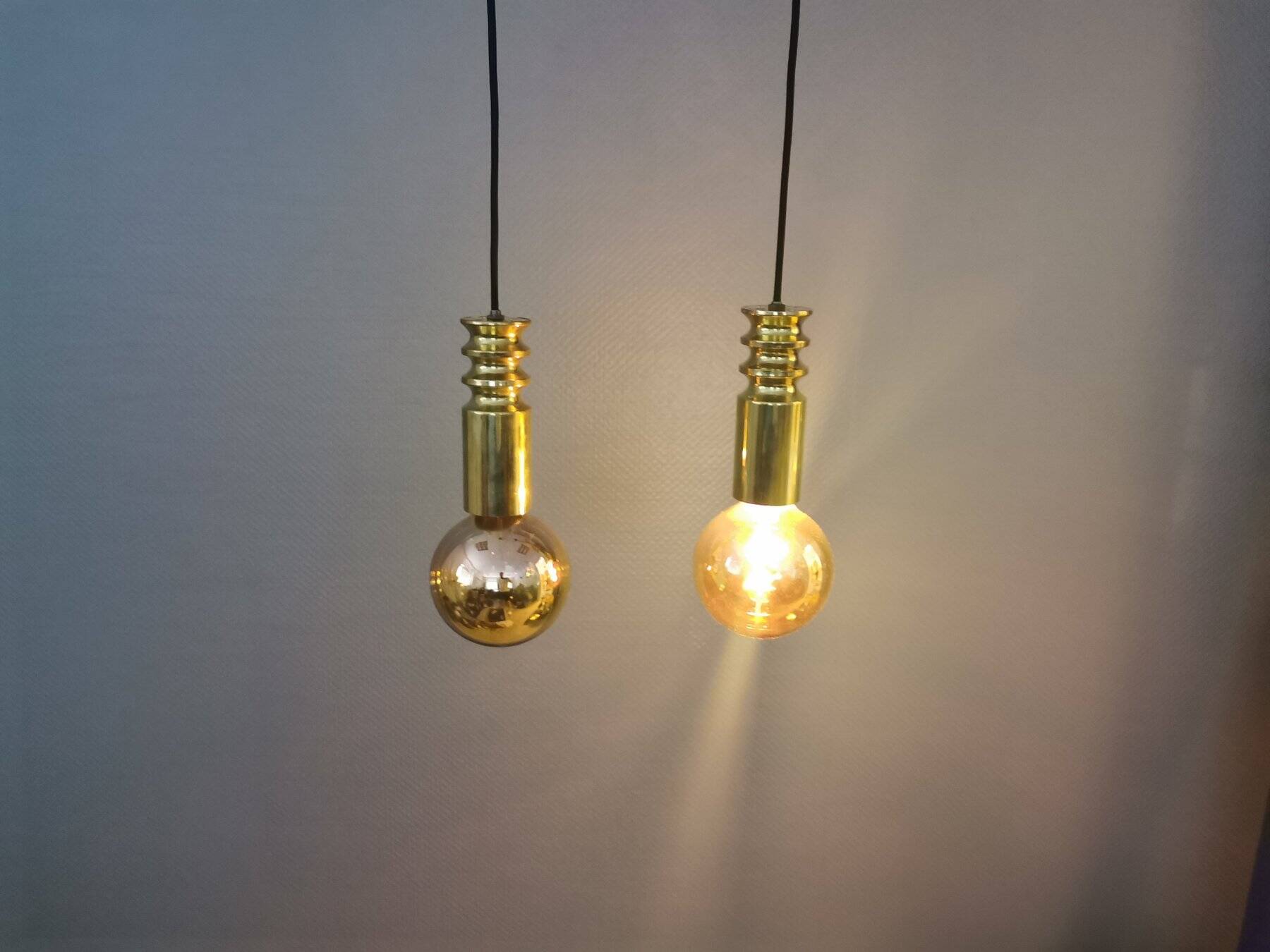Frimann Goldstar pendant lights made by Philips in the 1970s. Model SPYBALL