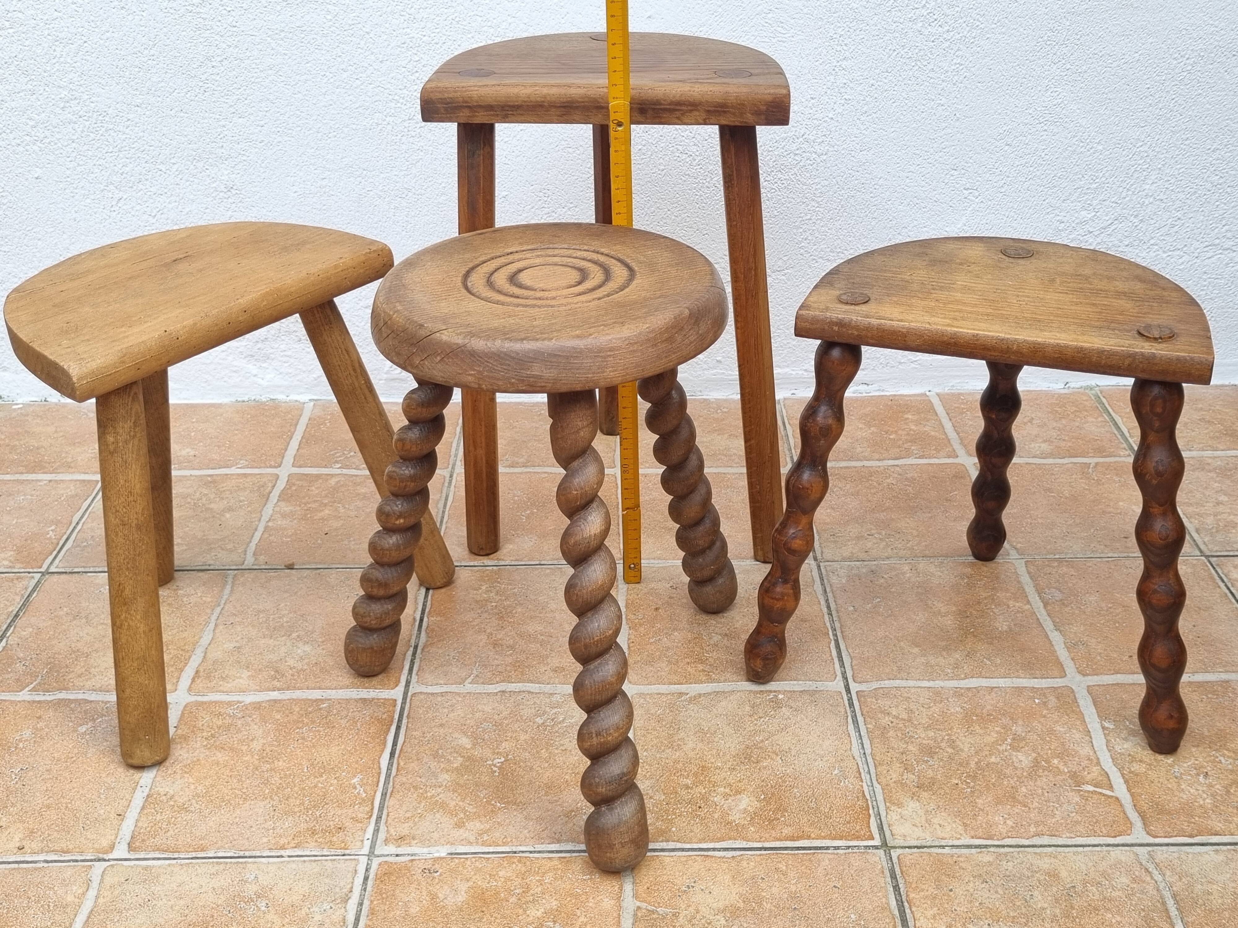 Set of four rustic solid wood plant holders, 31 to 43 cm