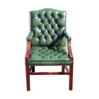 Mahogany armchair covered in green leather